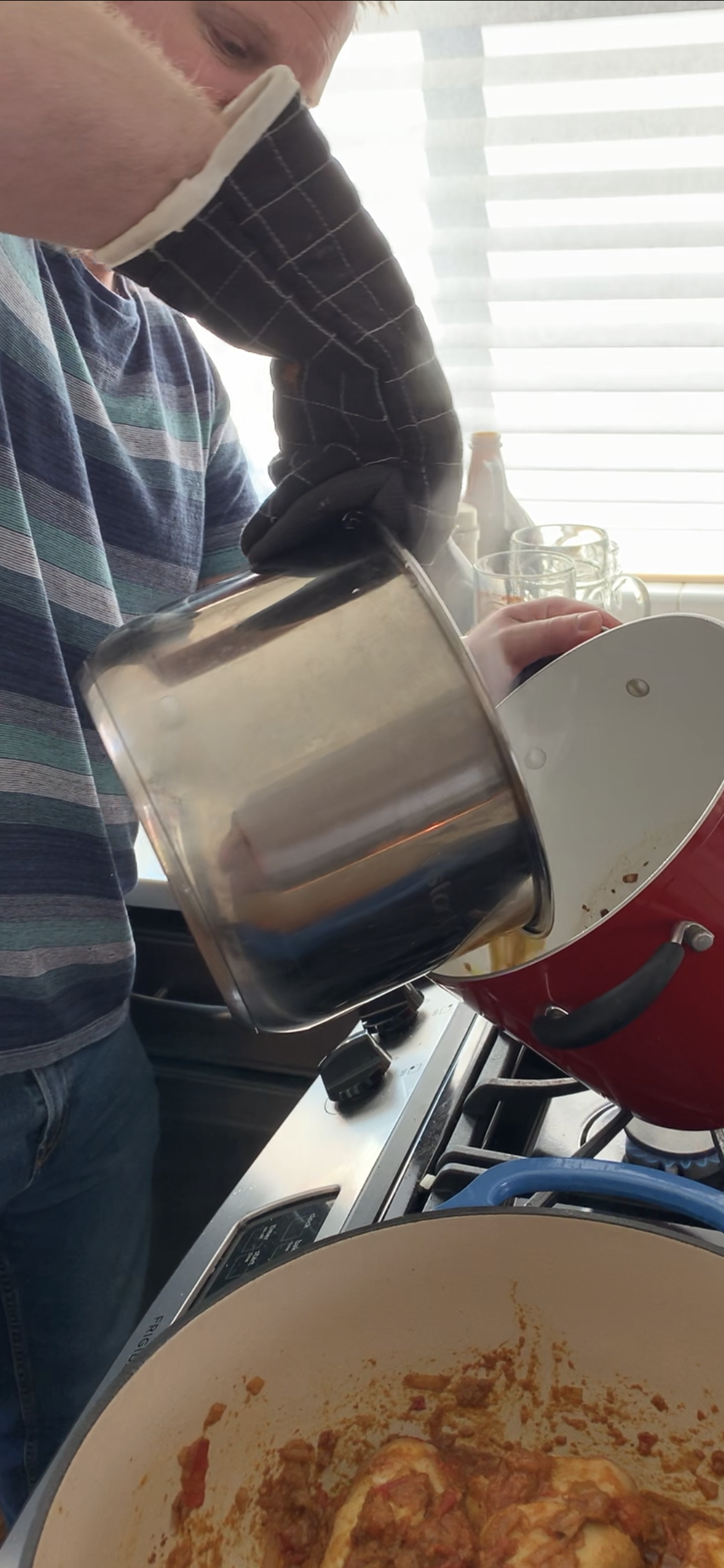 Pouring the dhal mixture from the instant pot into the pot with the bagaar mixture can be intimidating. Pour quickly and carefully, and use an oven mitt so you don't burn your hands!