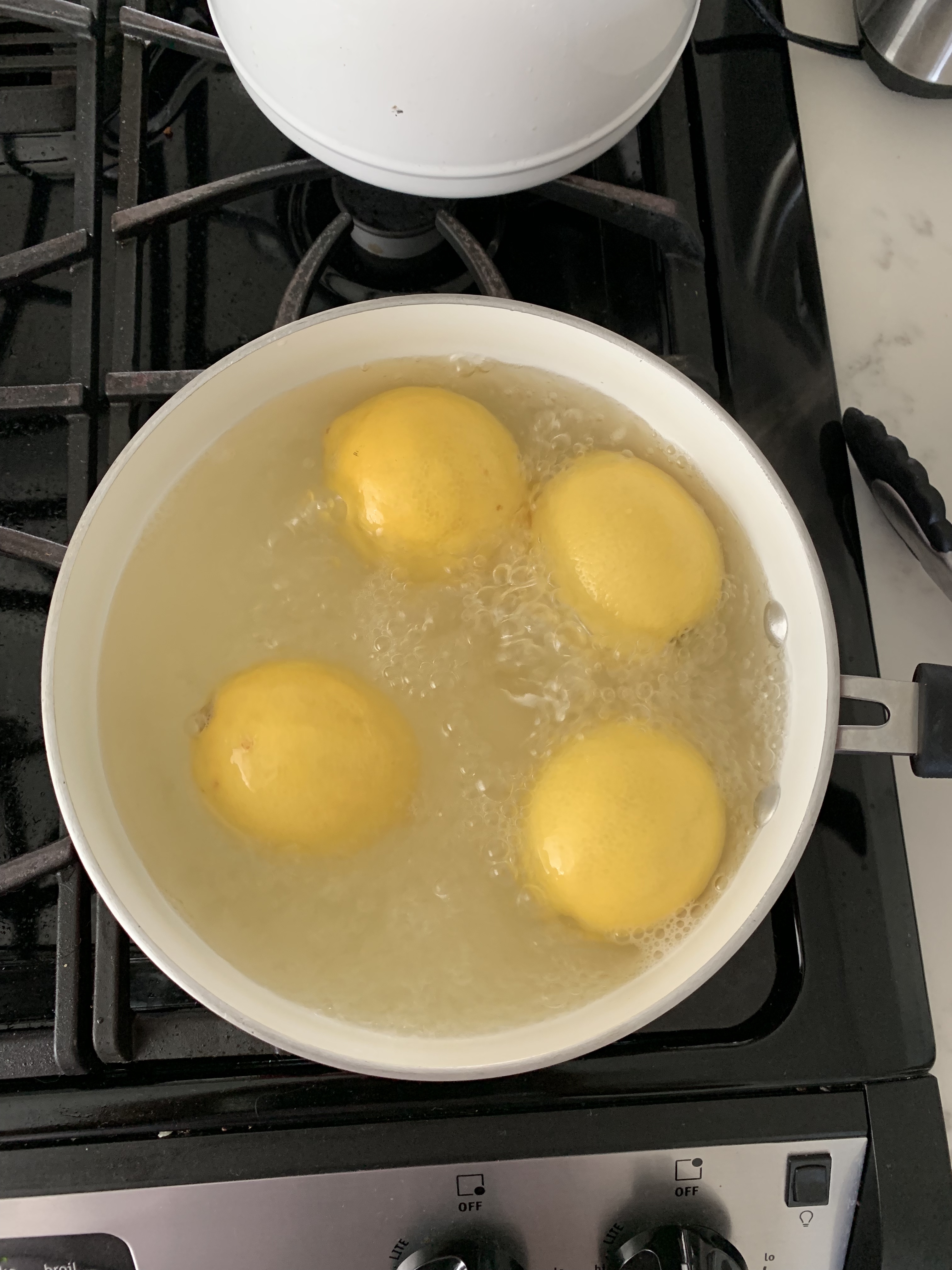I made home made lemon curd, and it was so easy! This is a photo of me boiling the whole lemons, before putting them in the food processor. 